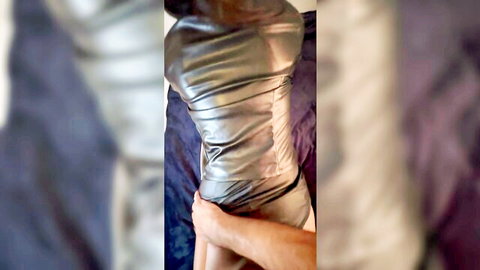 Sexy woman in tight shiny leather dress gripped from behind POV view
