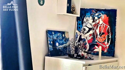 Bella Mur sex vlogs behind-the-scenes room with sensual couple art paintings and makeup vanity shelf