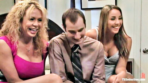 Blonde and brunette TS models seducing suited man in threesome tease