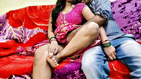 Sexy Indian babe in pink saree spreads thighs showing bare feet hugged by boyfriend on couch