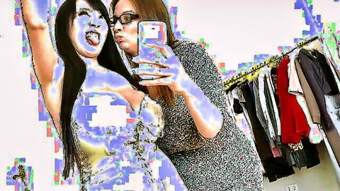 Hitomi Tanaka and friend smiling selfie in clothing store