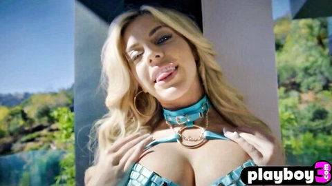 Blonde babe with big boobs in chain top and choker teases outdoors