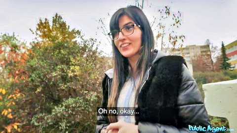 Cute brunette with glasses smiles outdoors in Public Agent pickup tease