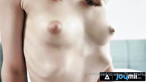 Closeup of busty blonde's perky nipples and big tits fully exposed topless.