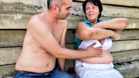Chubby mature granny topless outdoor grope with bald man