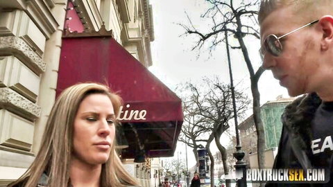 Blonde woman flirts with sunglasses guy on public street outside Valentine bar