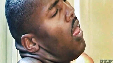 Closeup of ecstatic black man with mustache moaning in pleasure