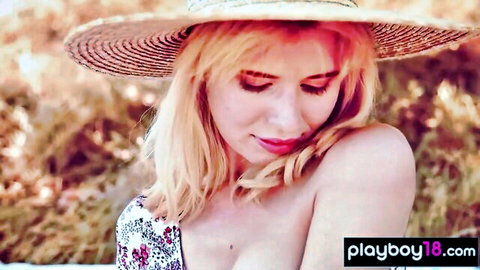Blonde teen in straw hat teases juicy cleavage in floral dress outdoors