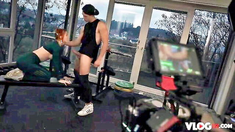 Charlie Red kneels for intimate gym scene with partner