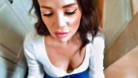 Seductive brunette MILF in low-cut white top showing deep cleavage