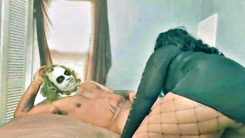 Joker-masked man gets ridden by curvy babe in green dress and fishnets