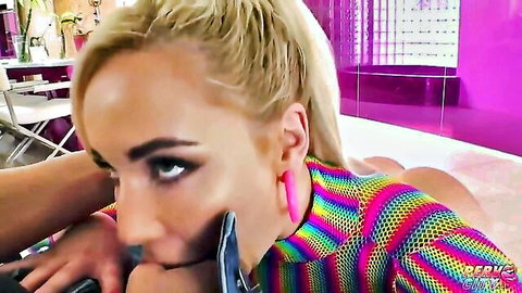 Big titted blonde in colorful bodysuit gives blowjob to Michael Stefano