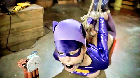 Christina Carter in Catwoman cosplay, bound and gagged in intense lesdom scene