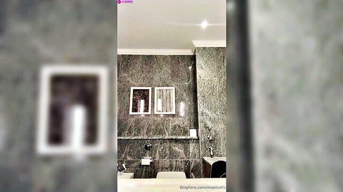 Blurry luxury green marble bathroom interior with sinks and OnlyFans watermark teasing striptease