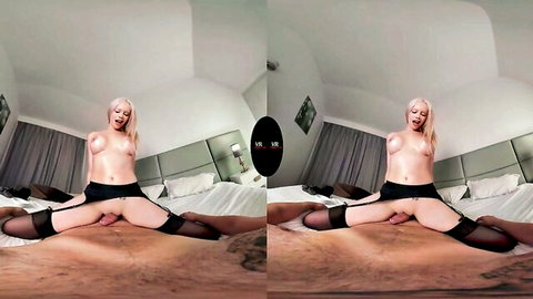 Blonde wife spreads legs wide in black stockings, exposing pussy on bed