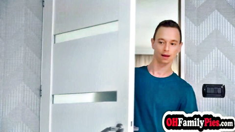 Stepbrother peeking through open bathroom door with naughty expression in taboo scene