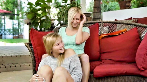 Kylie Nicole and blonde sister cuddling intimately outdoors