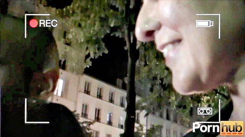 Amateur French couple smiling intimately outdoors at night before sex