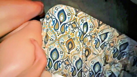 Teasing close-up of woman's thighs in blue paisley skirt, hinting at seduction for a ride