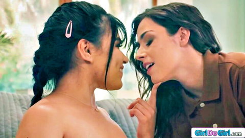 Two topless Latinas in intimate close-up embrace