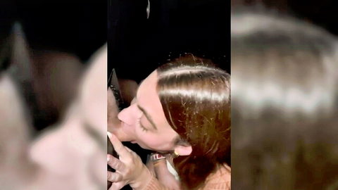 Blurry brunette passionately kissing muscular guy in dark club closeup
