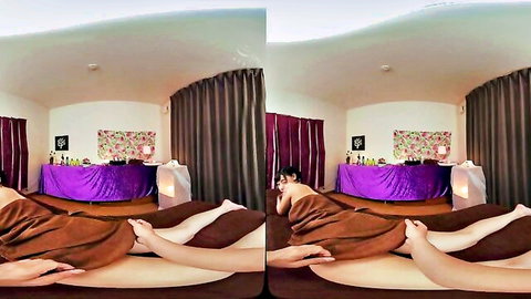 Asian woman enjoys sensual VR massage, relaxing prone on table