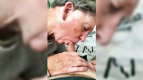Older man kissing mature woman's tattooed abdomen intimately