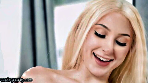 Blonde pornstar Skylar Vox smiles seductively in topless tease