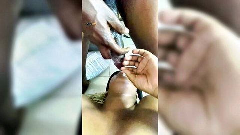 Ebony hands manipulating exposed black cock in closeup medical play scene