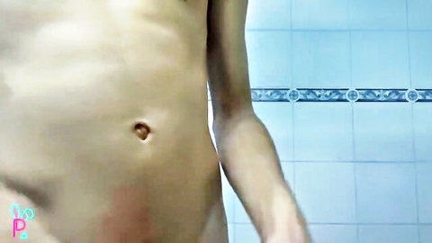 Slim young man masturbating in public shower, big cumshot