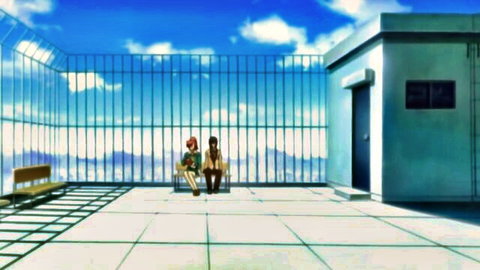 Two anime schoolgirls with red and brown hair sit on rooftop bench in hentai episode