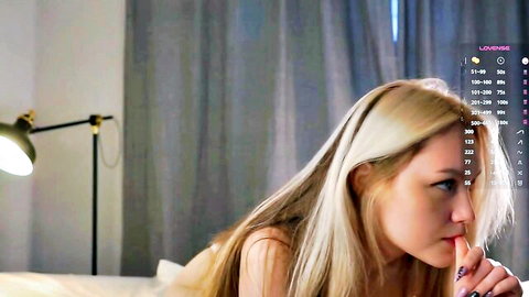 Pale busty blonde Emmie Murray seductive stream pose
