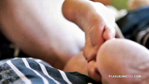 Babe's bare toes grip throbbing cock in closeup footjob action