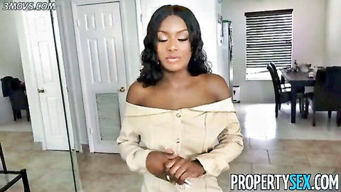 Foxy busty black real estate agent in off-shoulder top