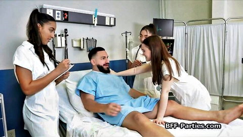 Three sexy nurses in tight uniforms surround and tease smiling bearded black patient in hospital bed