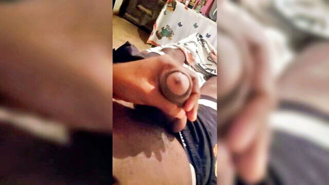 Ebony hand gripping thick black cock close-up, amateur masturbation