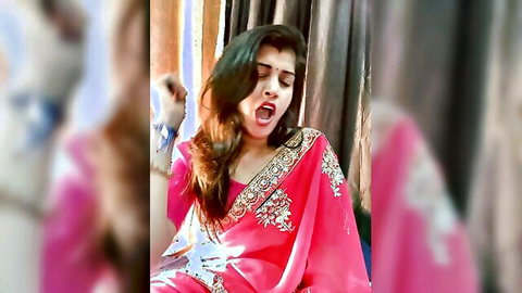 Anupama Joshi in glamorous pink saree, teasing with aroused expression on cam