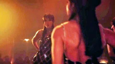 Taylor Swift in sexy sparkly dress, back view on stage performance