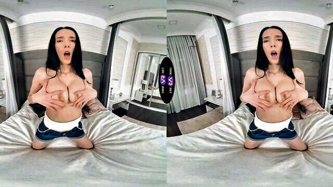 Jasmine Jae topless VR tease, busty brunette covering big tits on bed