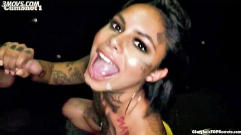 Tattooed ebony Genevive in intense gloryhole blowjob and facial
