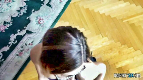 POV of skinny glasses girl with small tits and long hair kneeling for blowjob on floor