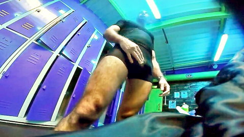 Hairy muscular DILF grabs big bulge in tight black gym shorts in purple locker room POV