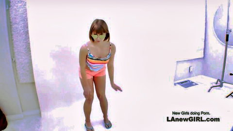 Cute Asian teen Lana in striped bikini and shorts posing seductively