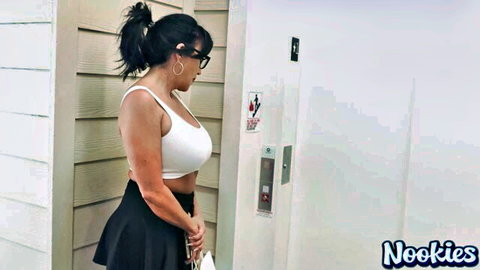 Abi James MILF in white tank top and black mini skirt by elevator