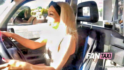 Blonde driver in revealing white dress smiles in FAN TAXI car pickup scene
