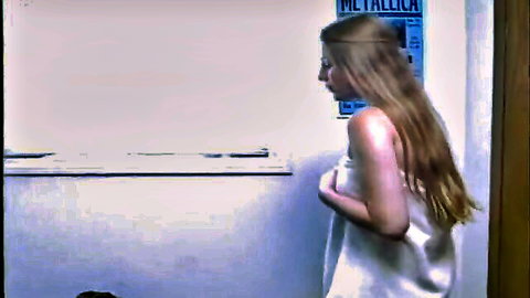 Beautiful blonde teen in white towel, side profile pose