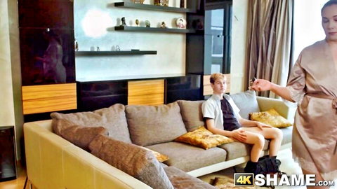 Kris Vog as cheating cougar in robe seduces young neighbor on couch