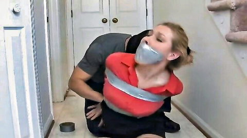 Man gropes exposed tits of topless blonde gagged and bound with duct tape in bondage