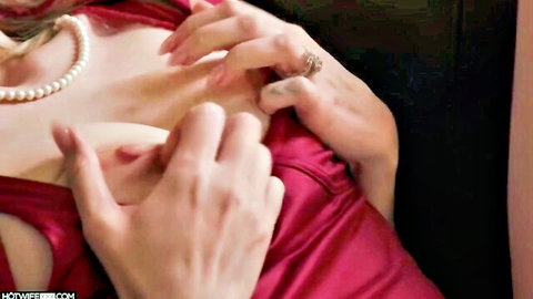 Melody Marks squeezes her big tits in low-cut red dress and pearls