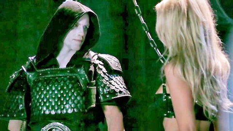 Jessica Drake in thrilling BDSM fantasy scene with armored hunk